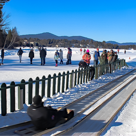 Image of Toboggan Sledder on Mirror Lake